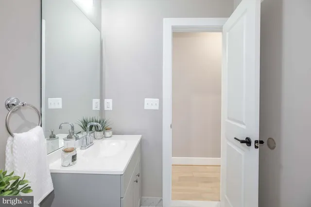 a bathroom with a sink and mirror