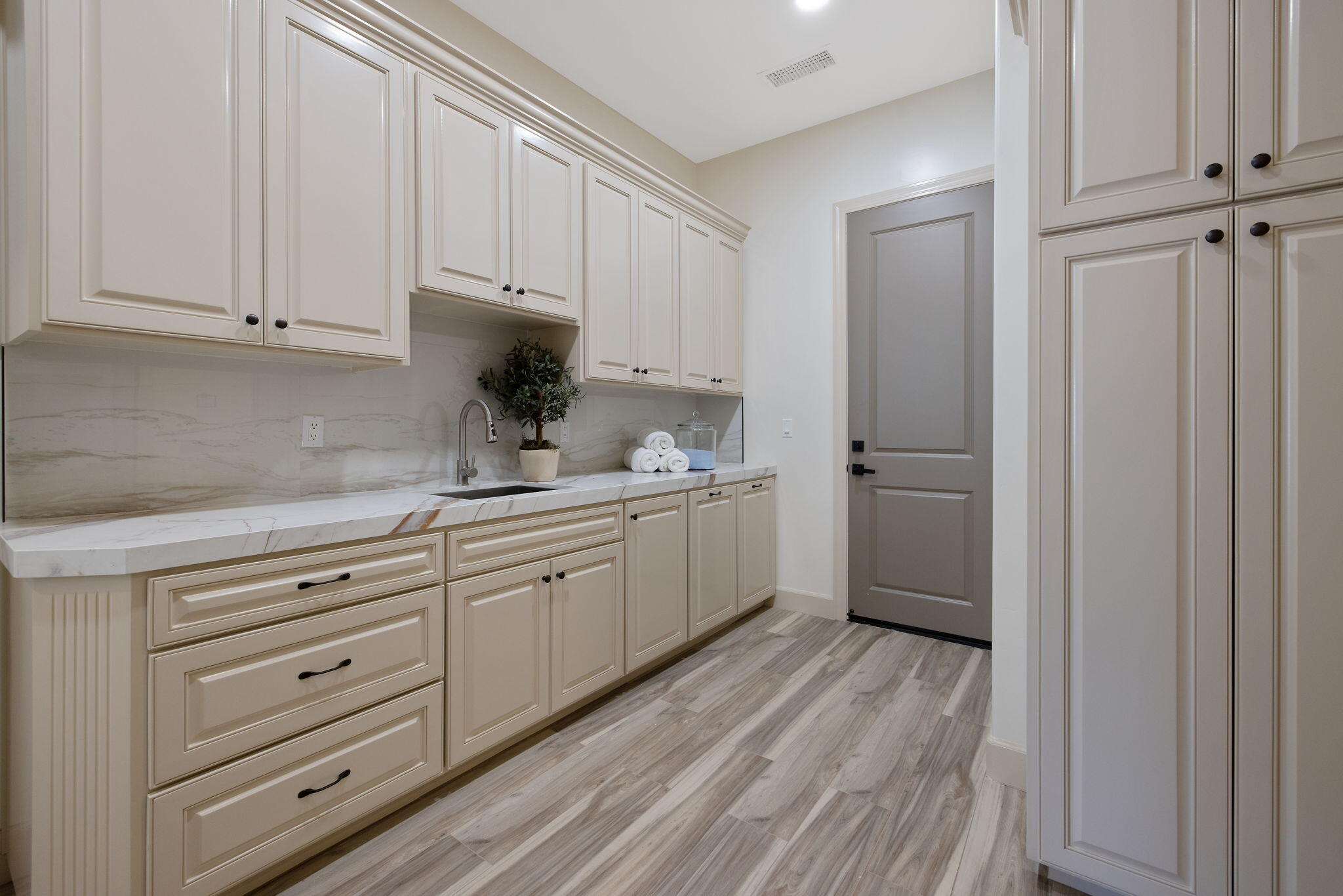 503 East Palm Street Exeter, CA 93221 - Photo 49 of 92 a kitchen with granite countertop white cabinets and white appliances