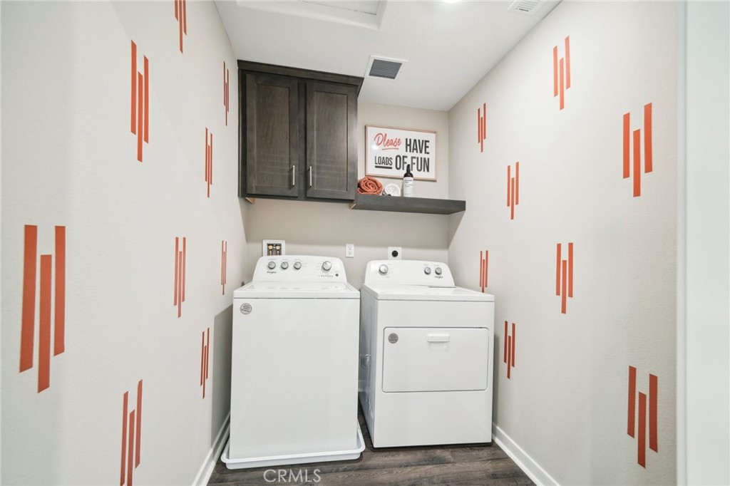 16051 Montenegro Lane Fontana, CA 92336 - Photo 15 of 17 a utility room with dryer and washer