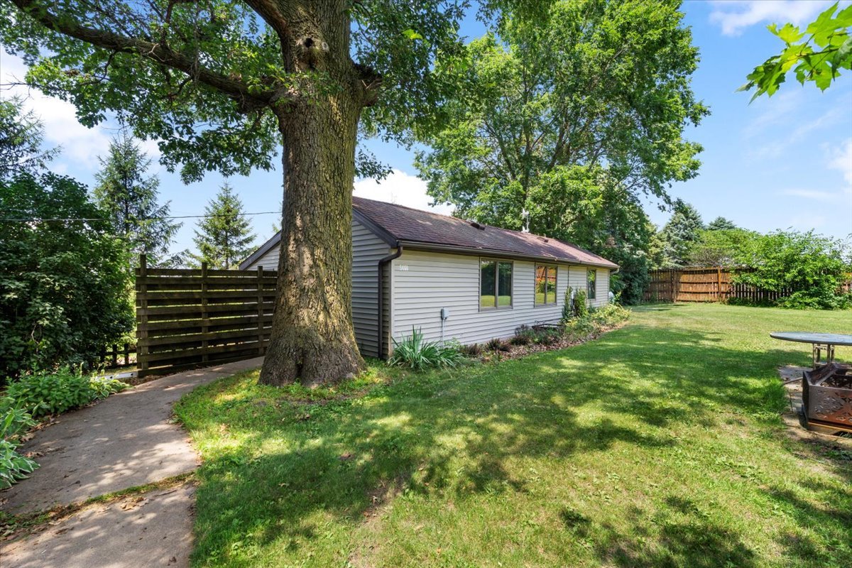5460 Moline Road Erie, IL 61250 - Photo 2 of 38 a view of backyard with large trees and plants