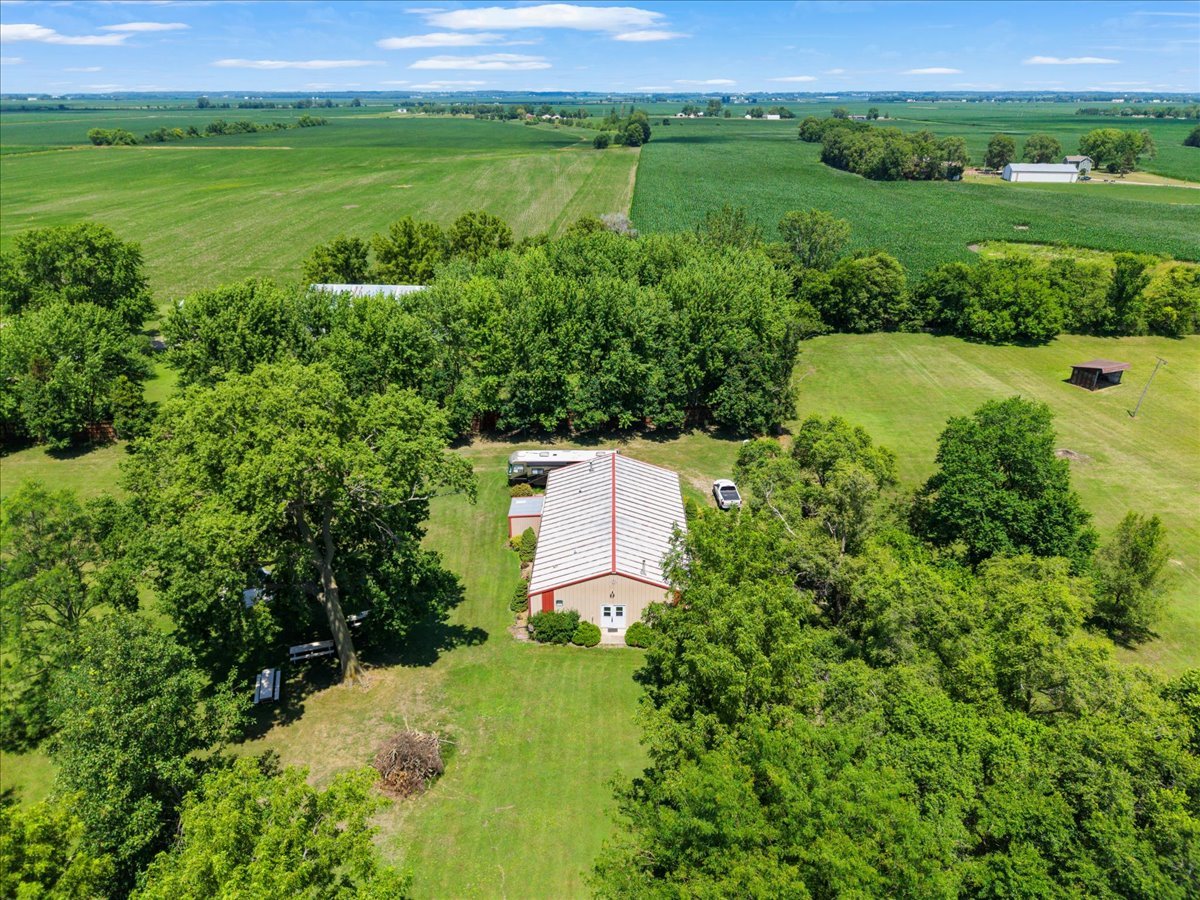 5460 Moline Road Erie, IL 61250 - Photo 34 of 38 a view of a garden with a building in the background
