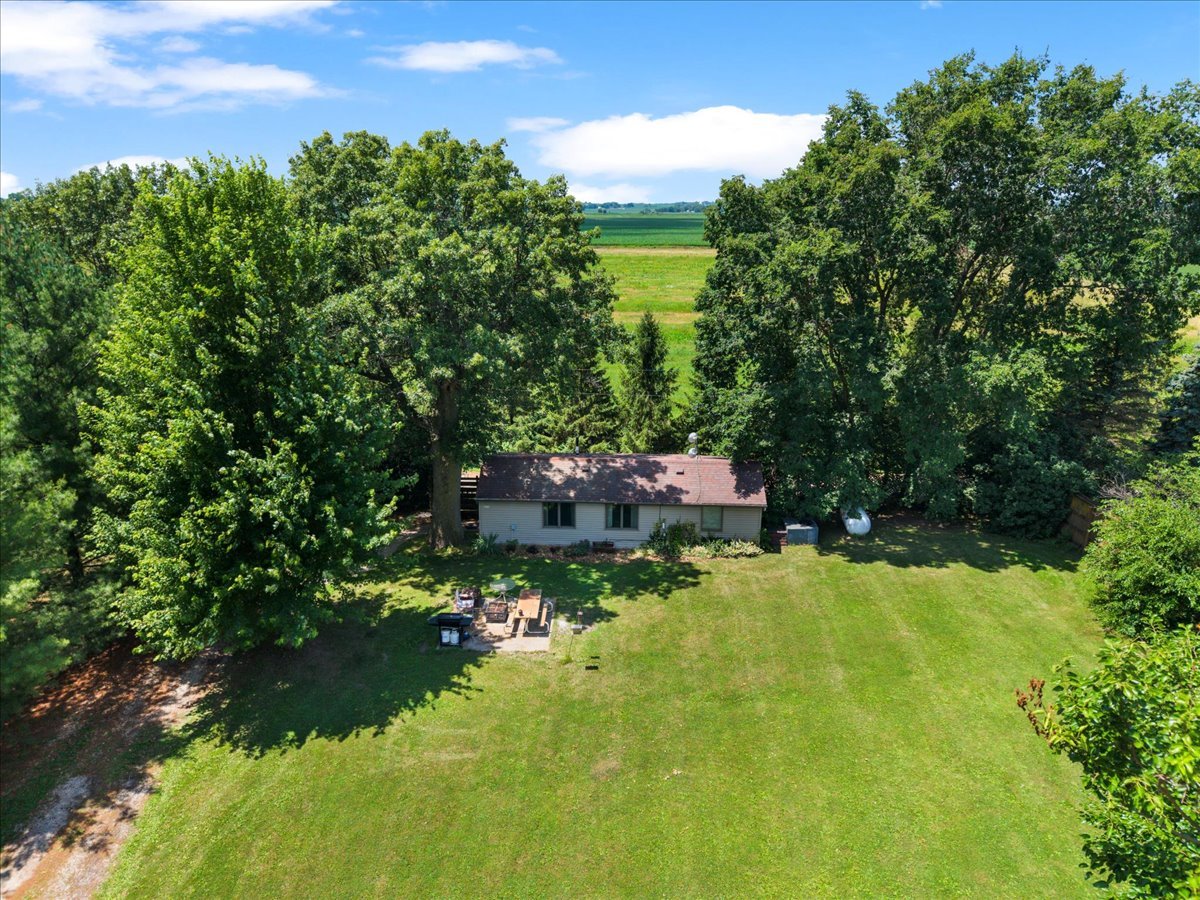 5460 Moline Road Erie, IL 61250 - Photo 35 of 38 a backyard of a house with a yard and lake view