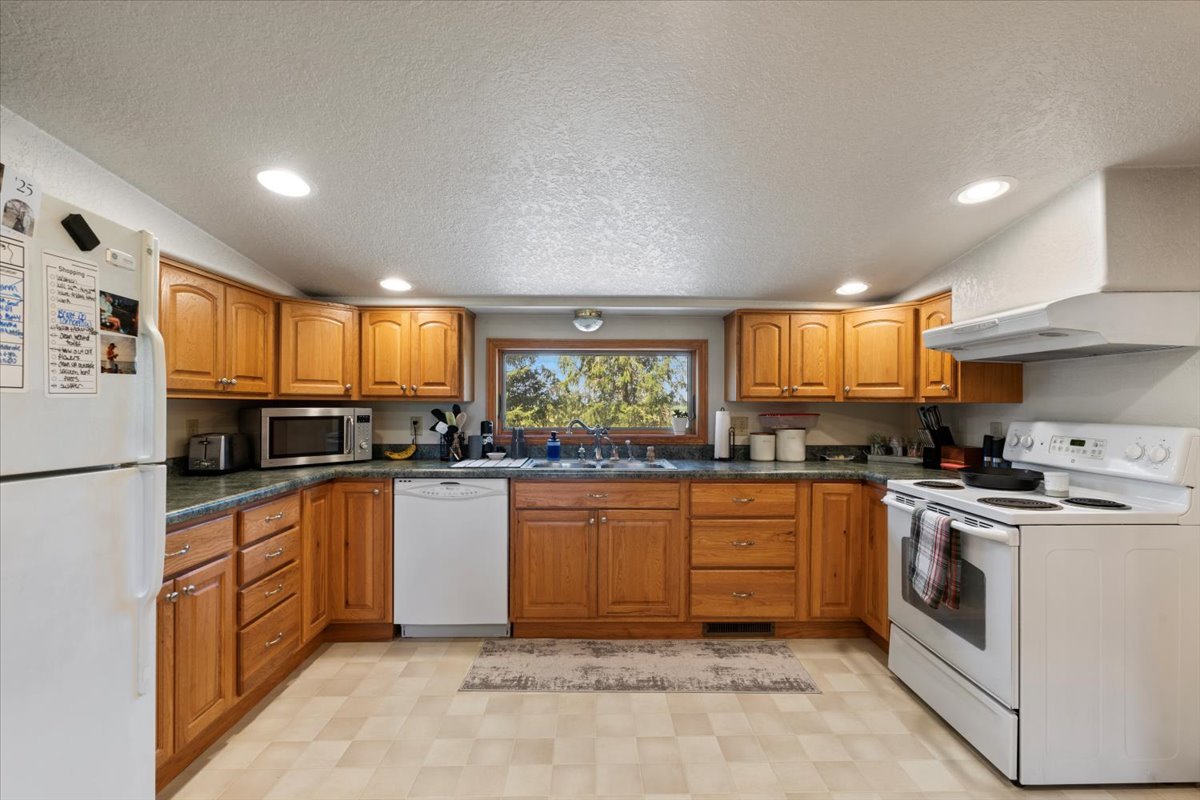 5460 Moline Road Erie, IL 61250 - Photo 5 of 38 a kitchen with granite countertop appliances a sink and a counter