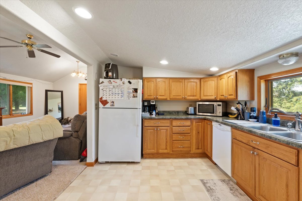 5460 Moline Road Erie, IL 61250 - Photo 6 of 38 a kitchen with stainless steel appliances granite countertop a refrigerator sink and cabinets