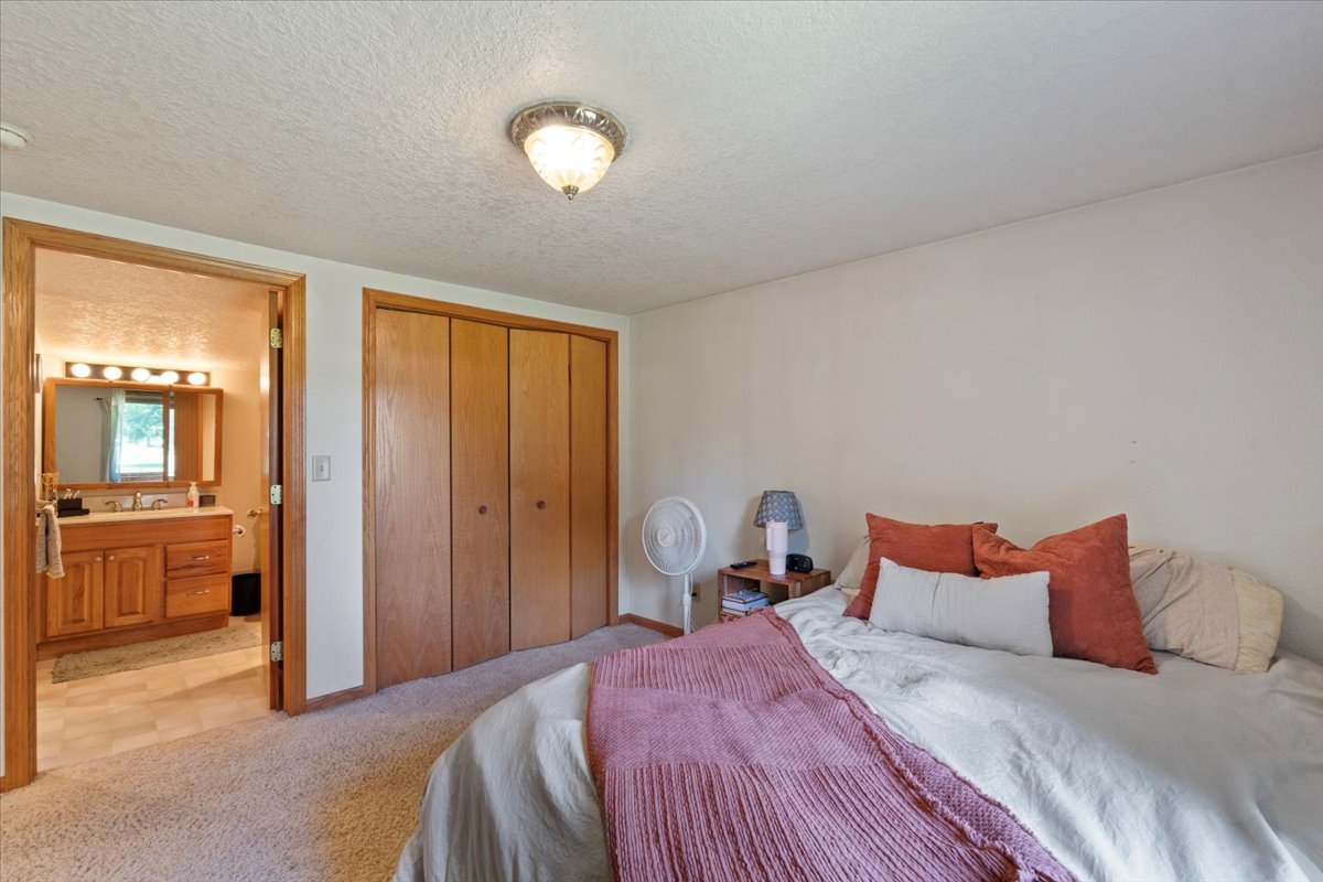 5460 Moline Road Erie, IL 61250 - Photo 10 of 38 a bedroom with a bed and wooden floor