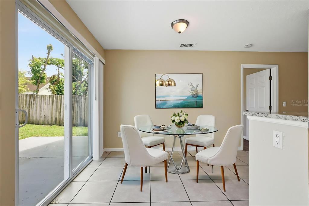 617 Greys Ferry Road Orlando, FL 32811 - Photo 4 of 35 a dining room with furniture and window
