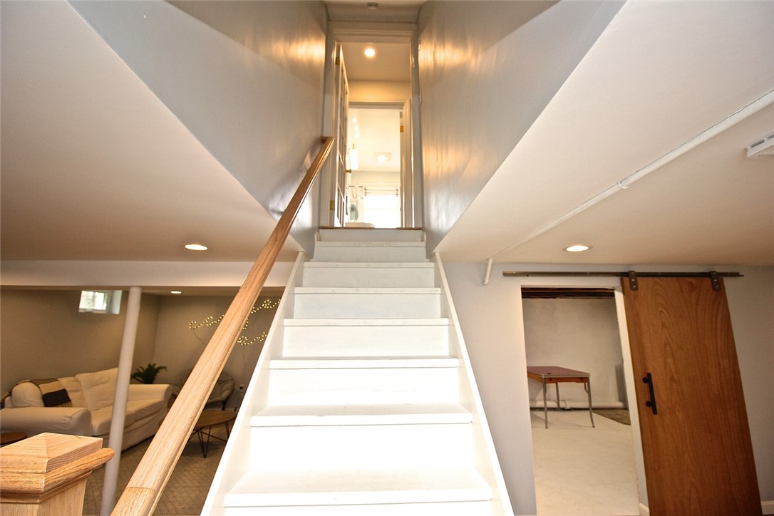 139 Coggeshall Avenue Newport, RI 02840 - Photo 38 of 50 Stairway view to 1st floor doorway leading to family room and laundry area