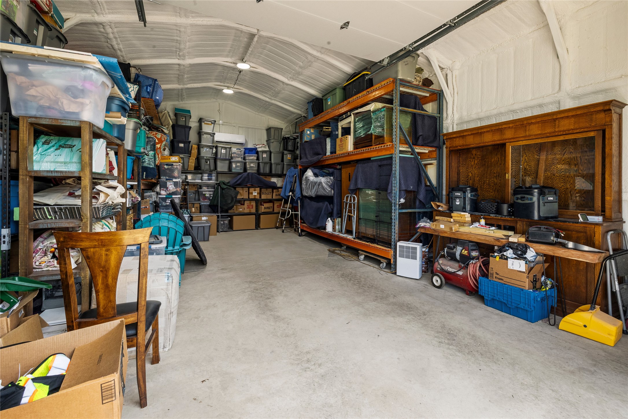 8200 Ranch Road 12 San Marcos, TX 78666 - Photo 28 of 40 A well-organized garage provides ample storage solutions with sturdy shelving and a dedicated workspace.