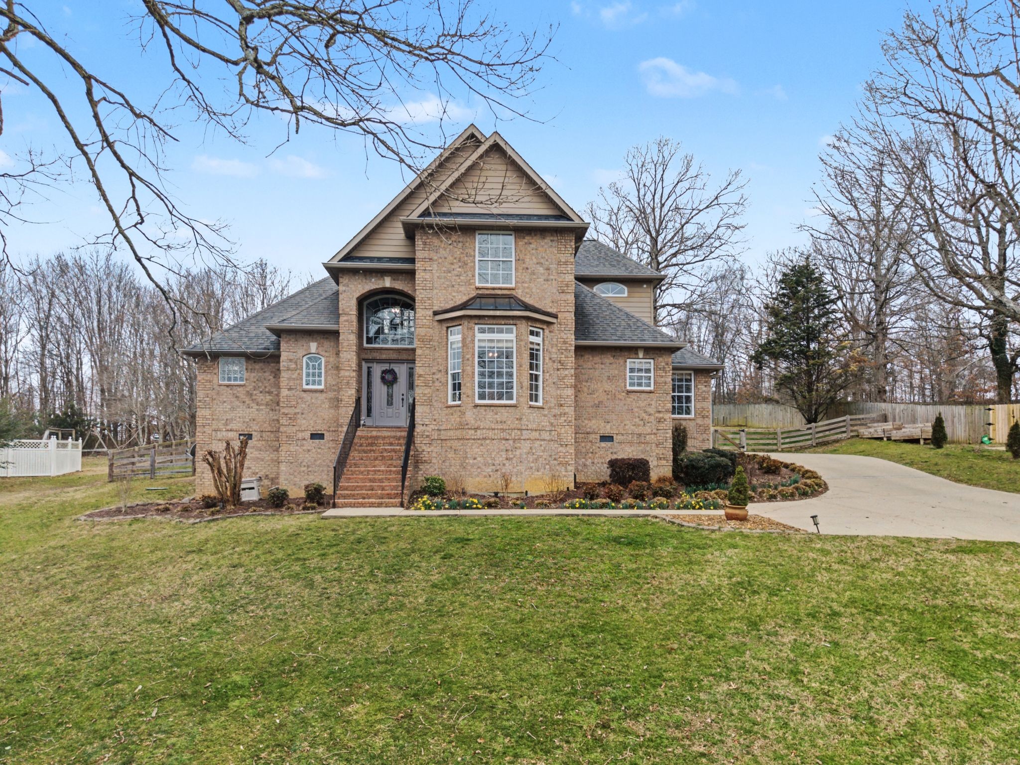 7331 McCormick Drive Fairview, TN 37062 - Photo 1 of 46 a front view of a house with a yard