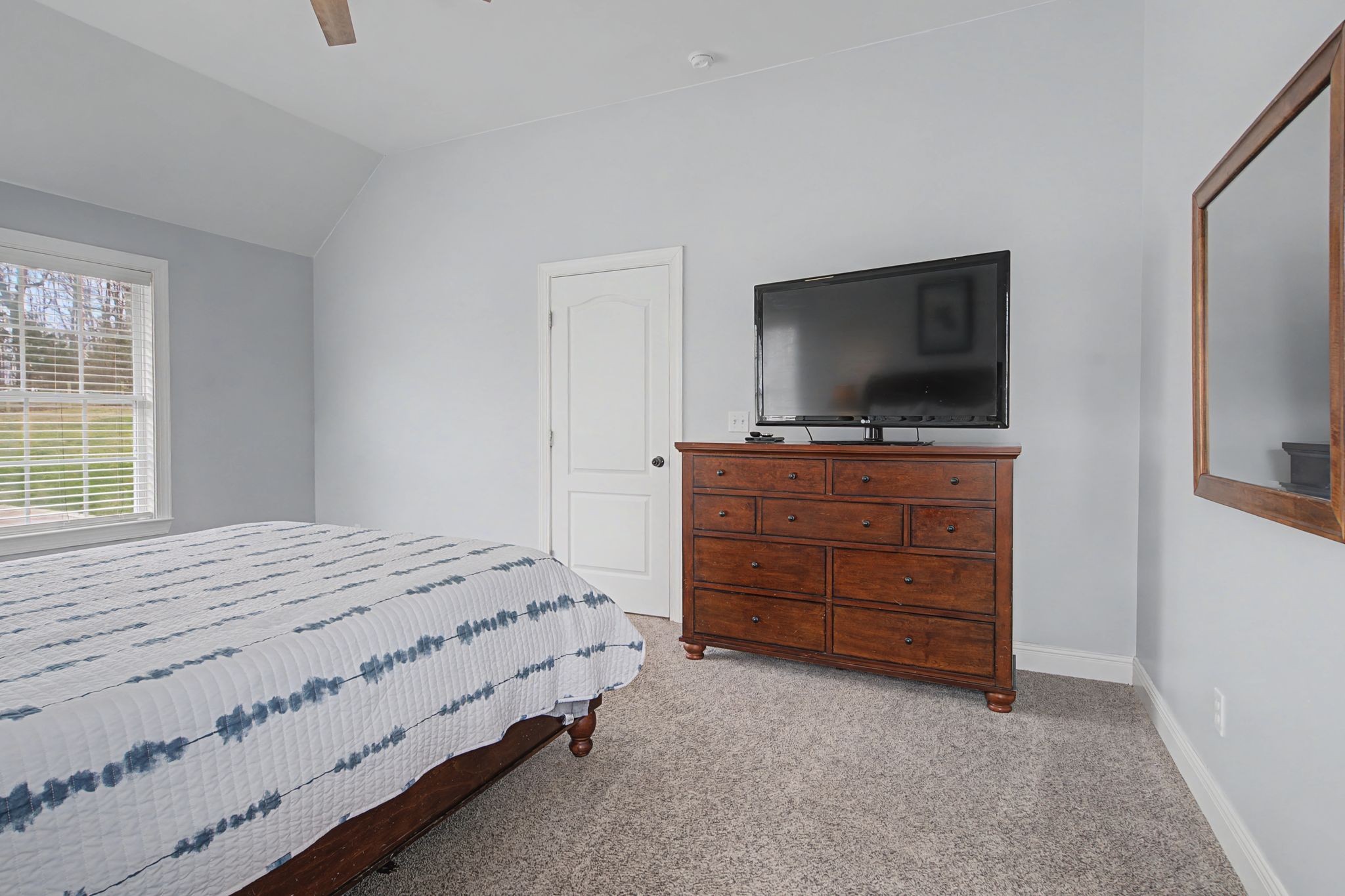 7331 McCormick Drive Fairview, TN 37062 - Photo 17 of 46 a bedroom with a bed and a flat screen tv
