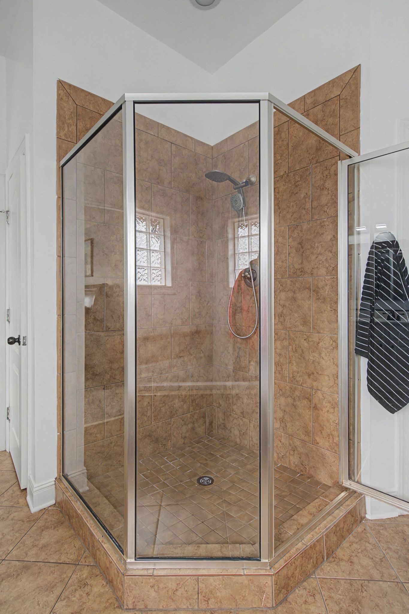 7331 McCormick Drive Fairview, TN 37062 - Photo 20 of 46 a bathroom with a glass shower door