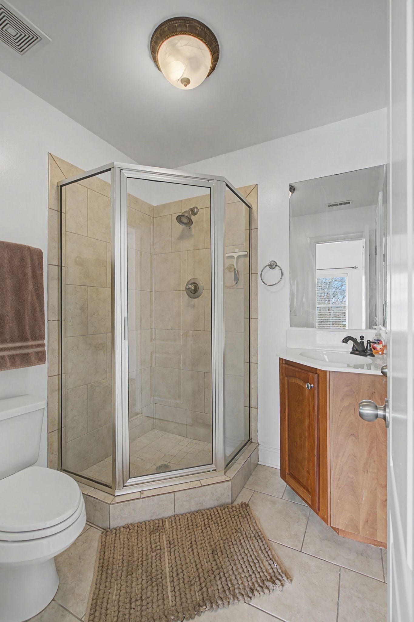 7331 McCormick Drive Fairview, TN 37062 - Photo 25 of 46 a bathroom with a sink a toilet and shower