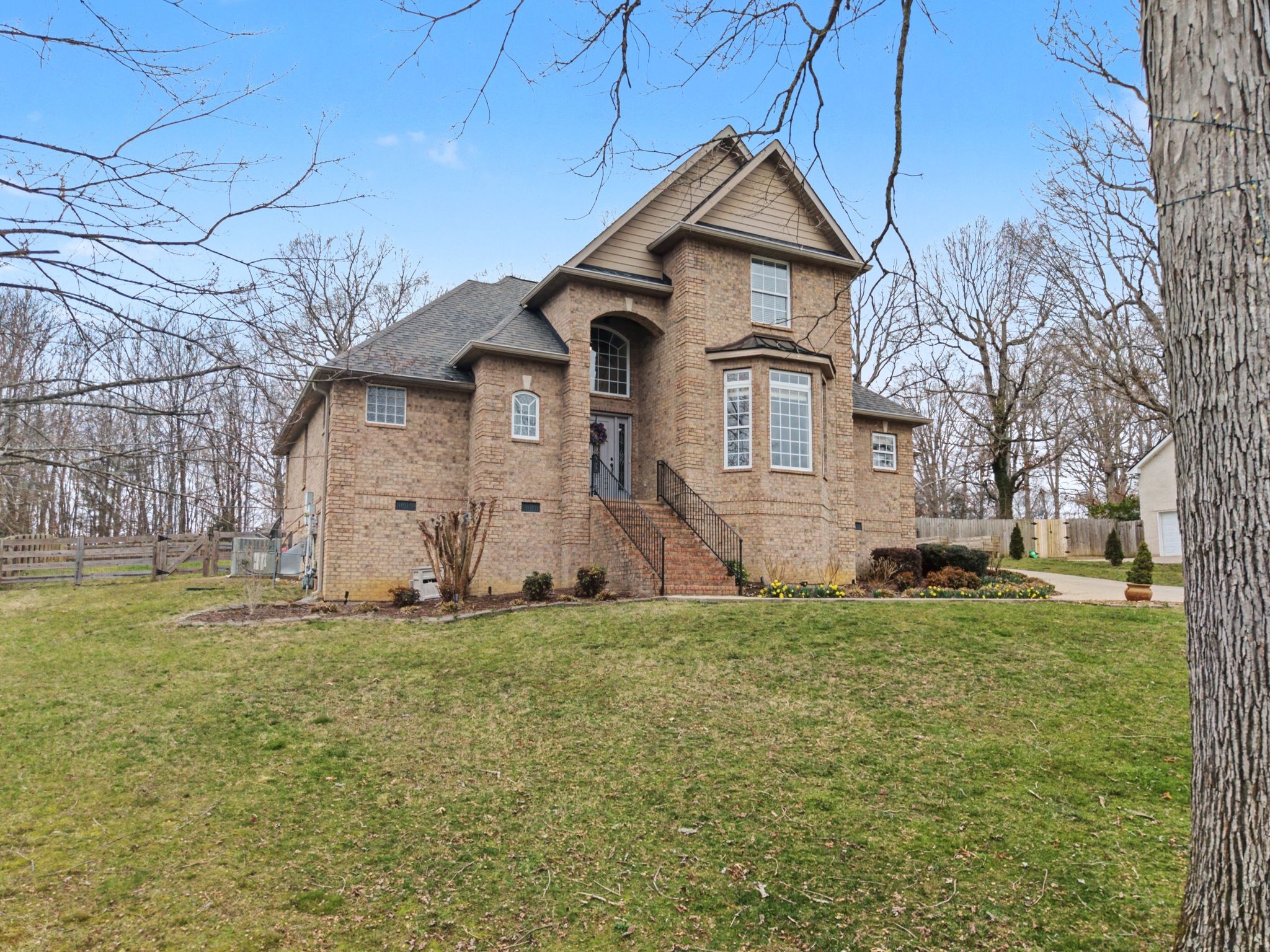 7331 McCormick Drive Fairview, TN 37062 - Photo 3 of 46 a front view of a house with a yard