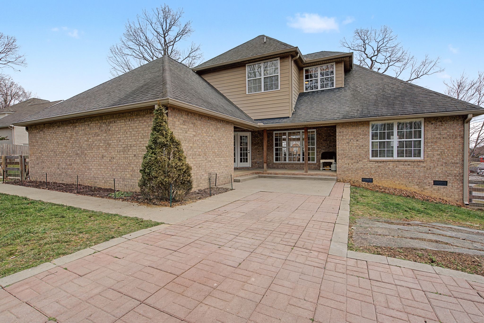 7331 McCormick Drive Fairview, TN 37062 - Photo 36 of 46 a front view of a house with garden
