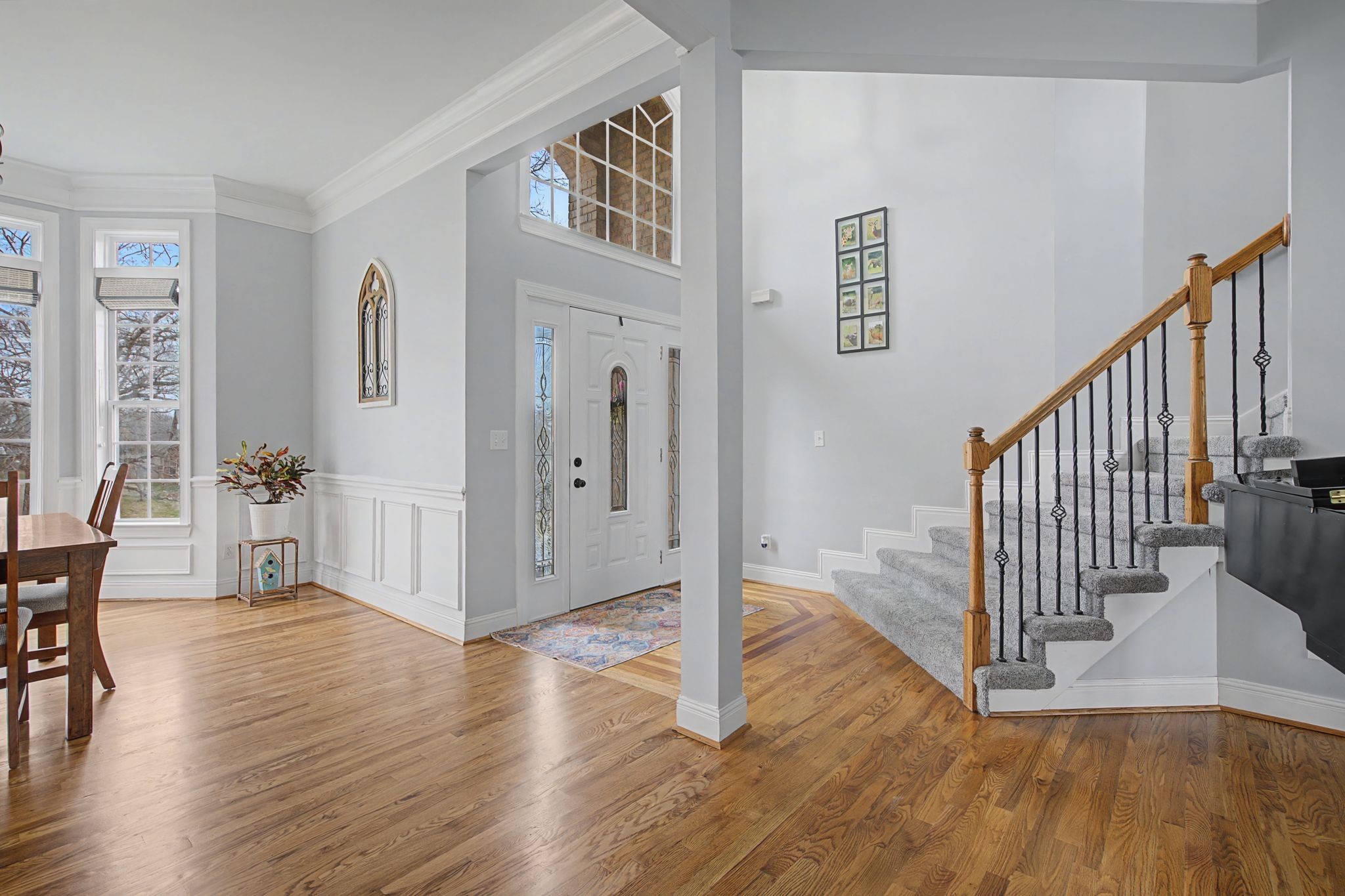 7331 McCormick Drive Fairview, TN 37062 - Photo 4 of 46 a view of a hallway with wooden floor and stairs