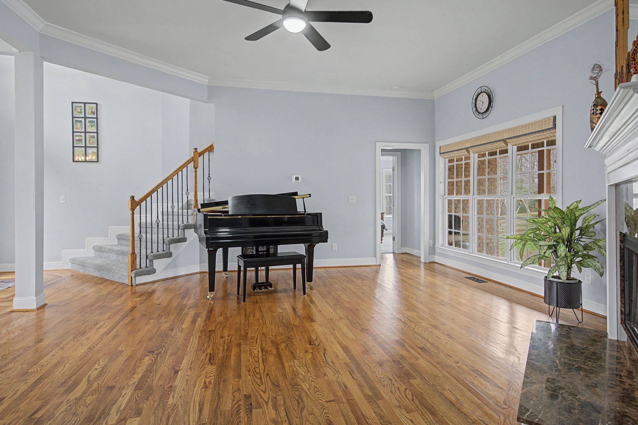 7331 McCormick Drive Fairview, TN 37062 - Photo 6 of 46 a view of a livingroom with furniture a ceiling fan and wooden floor
