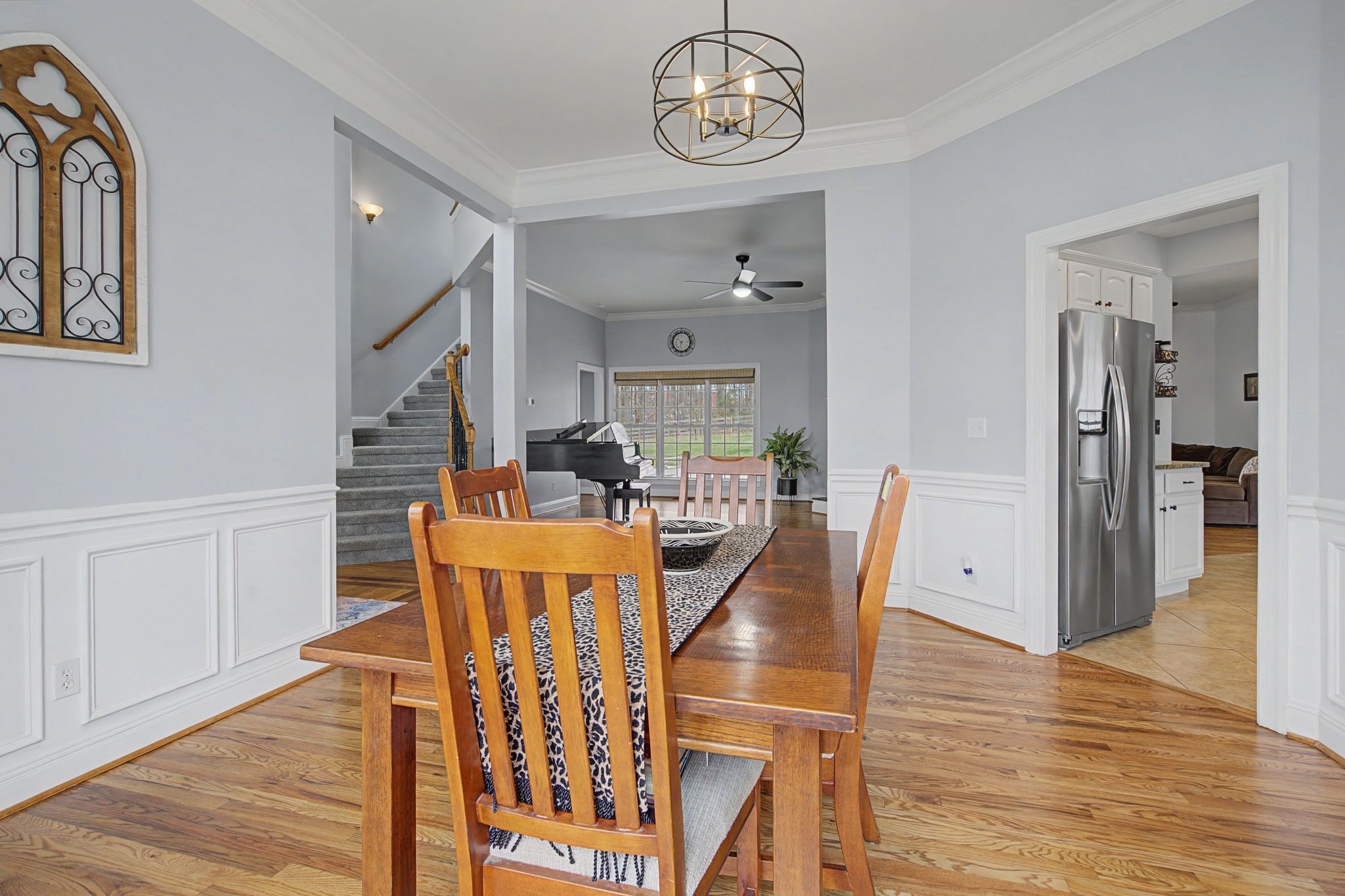 7331 McCormick Drive Fairview, TN 37062 - Photo 9 of 46 a view of a dining room with furniture wooden floor and chandelier