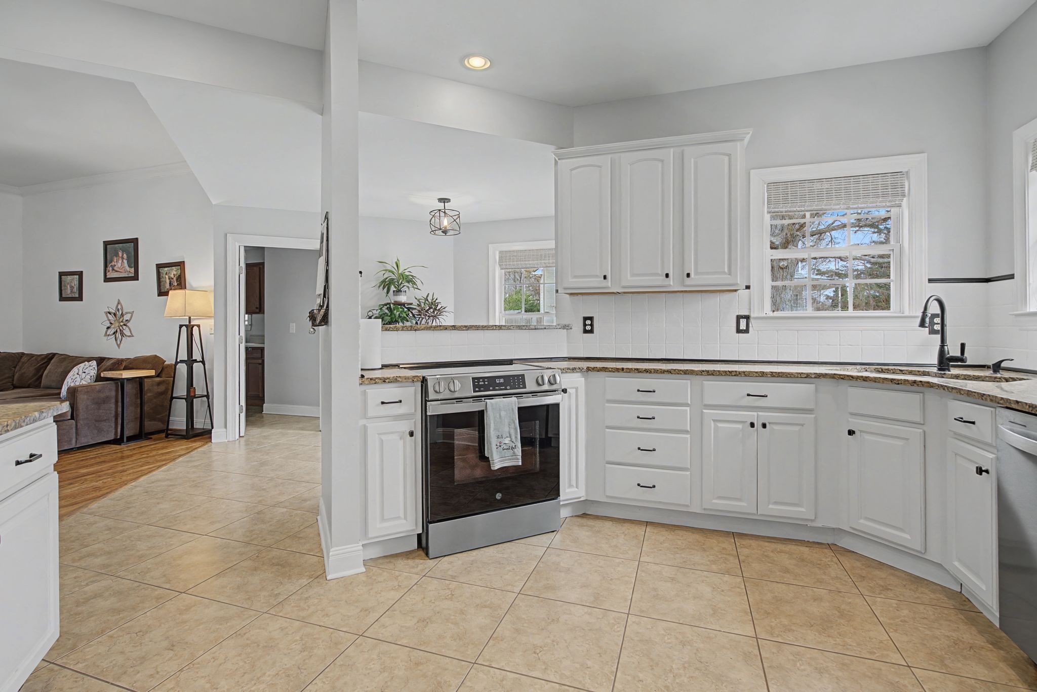 7331 McCormick Drive Fairview, TN 37062 - Photo 10 of 46 a kitchen with a stove top oven sink and cabinets