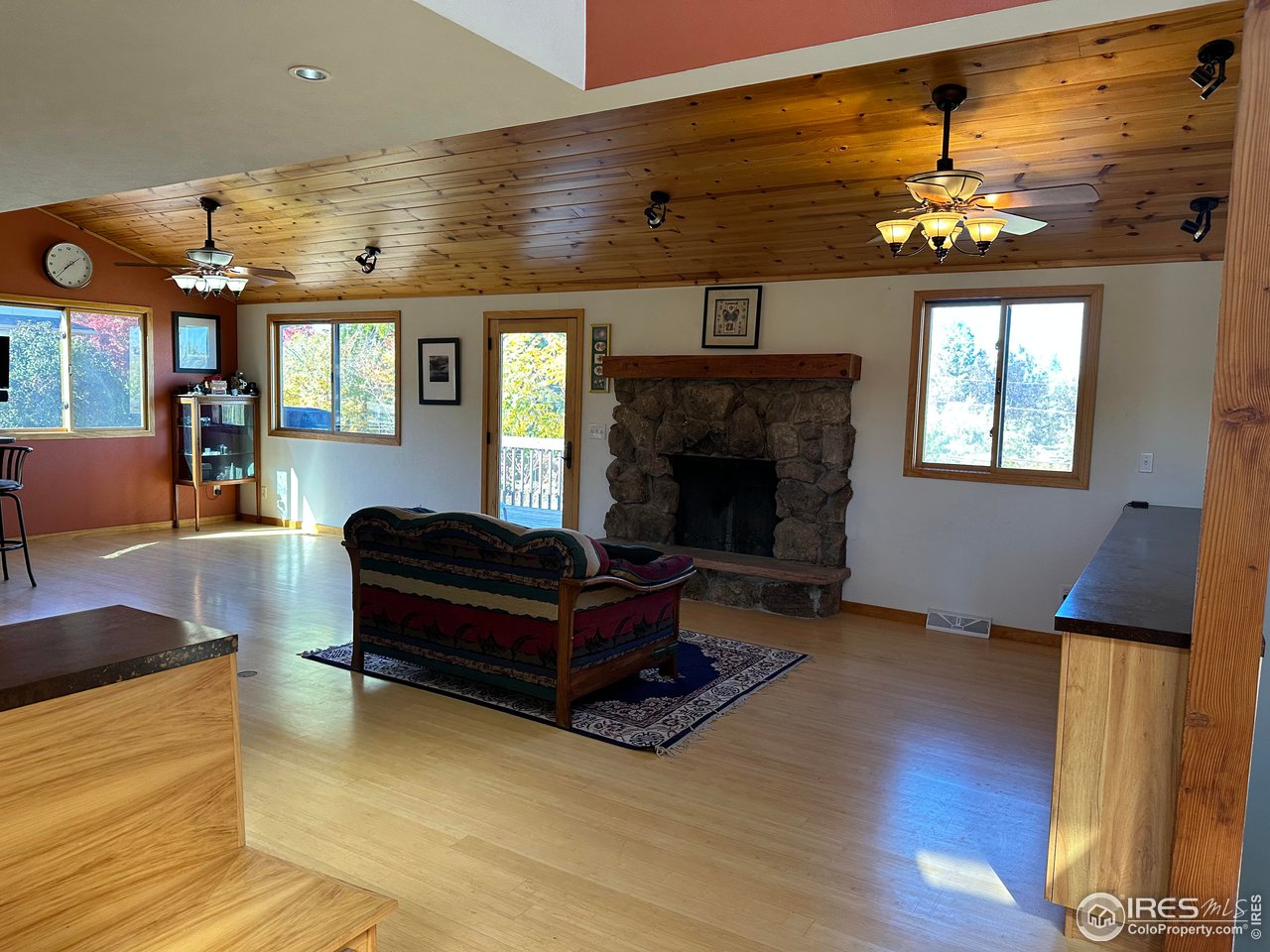 9057 Morton Road Niwot, CO 80503 - Photo 2 of 31 living room with wood-burning fireplace