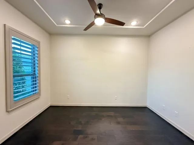 an empty room with a empty space and a window