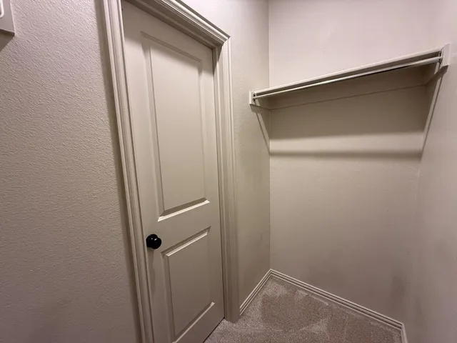 a bathroom with a glass door