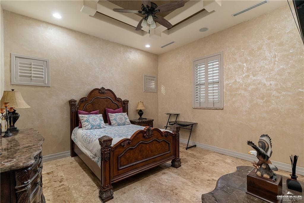 1205 Travis Street Mission, TX 78572 - Photo 25 of 45 a bedroom with a bed and a dresser