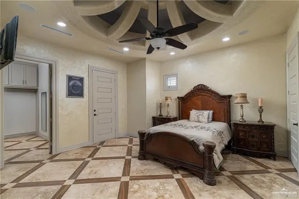 a bedroom with a bed and a television