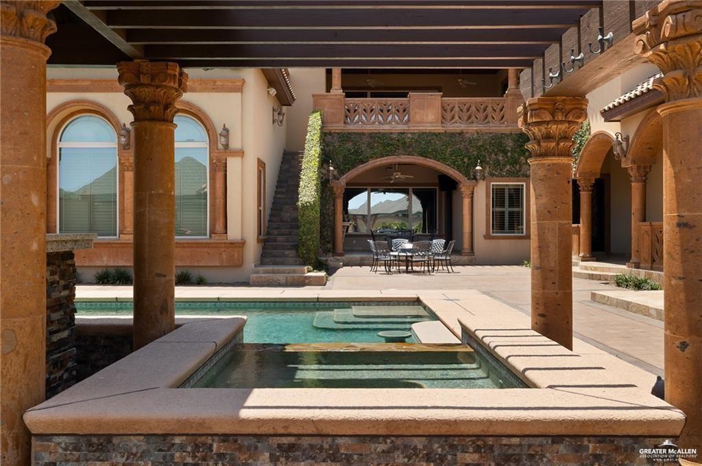 1205 Travis Street Mission, TX 78572 - Photo 37 of 45 a living room with fireplace furniture and a rug