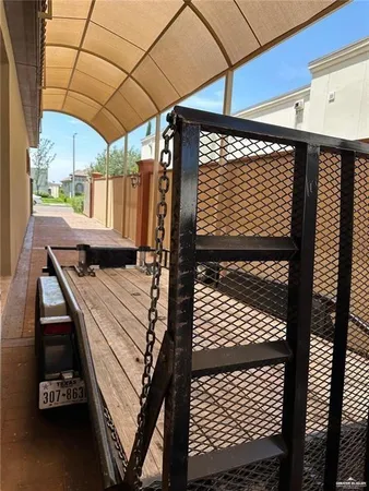 a view of a balcony with furniture