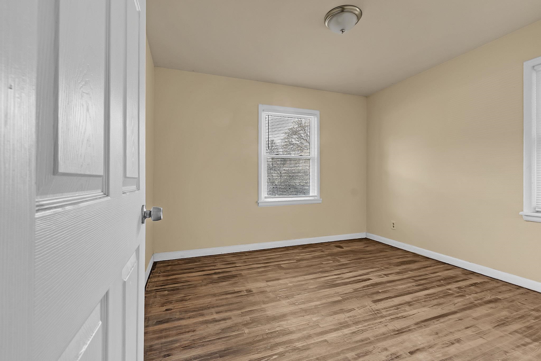 2196 Ketchum Road Memphis, TN 38114 - Photo 9 of 20 a view of a room that has wooden floor and window in it