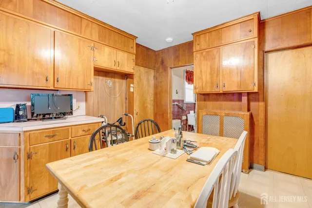 a kitchen with a table and chairs