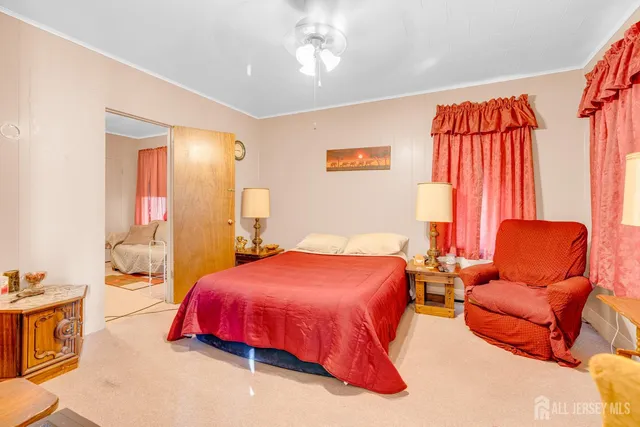 a bedroom with a bed and blue painted walls