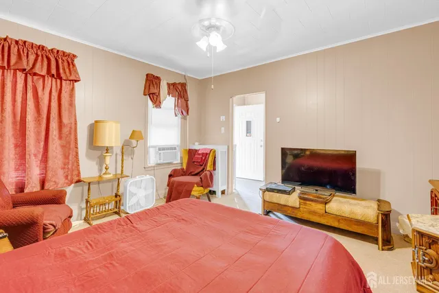 a bedroom with bed and window