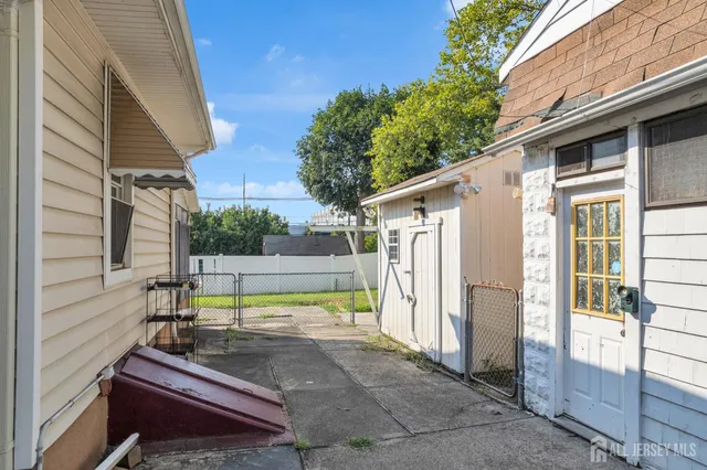 a view of backyard with large tree