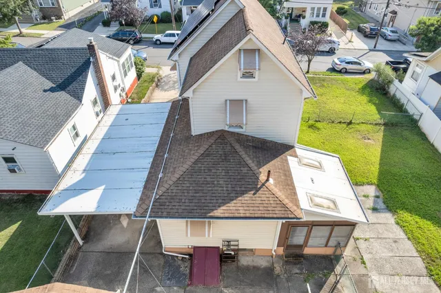 a view of outdoor kitchen and dining room with furniture