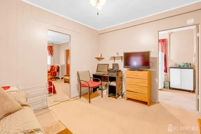 a children room with furniture and a flat screen tv