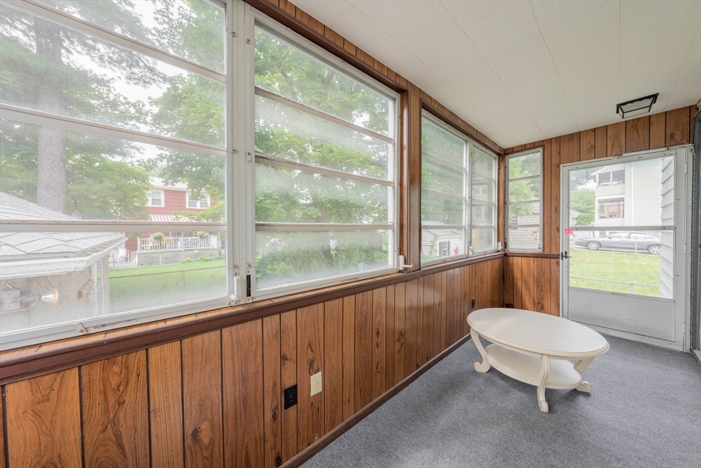63-65 Evans Street Watertown, MA 02472 - Photo 4 of 18 a bathroom with a toilet a sink and a large window