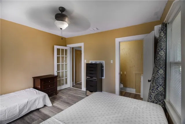 a bedroom with a bed and a walk in closet