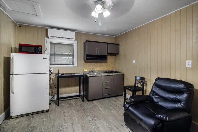 a kitchen with stainless steel appliances granite countertop a refrigerator stove and microwave