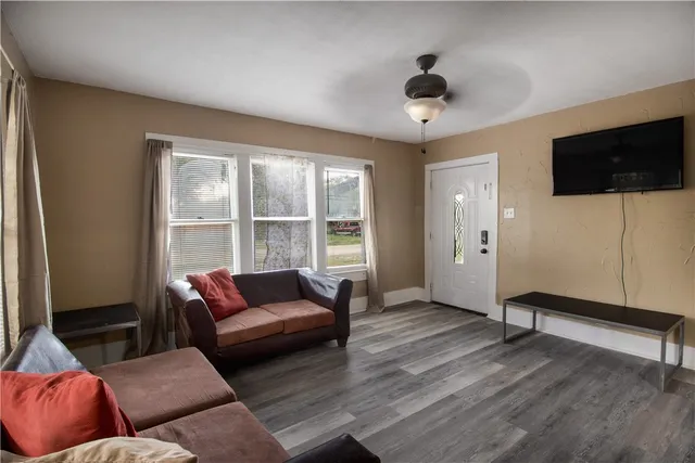 a living room with furniture and a flat screen tv