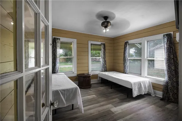 a bedroom with furniture and windows