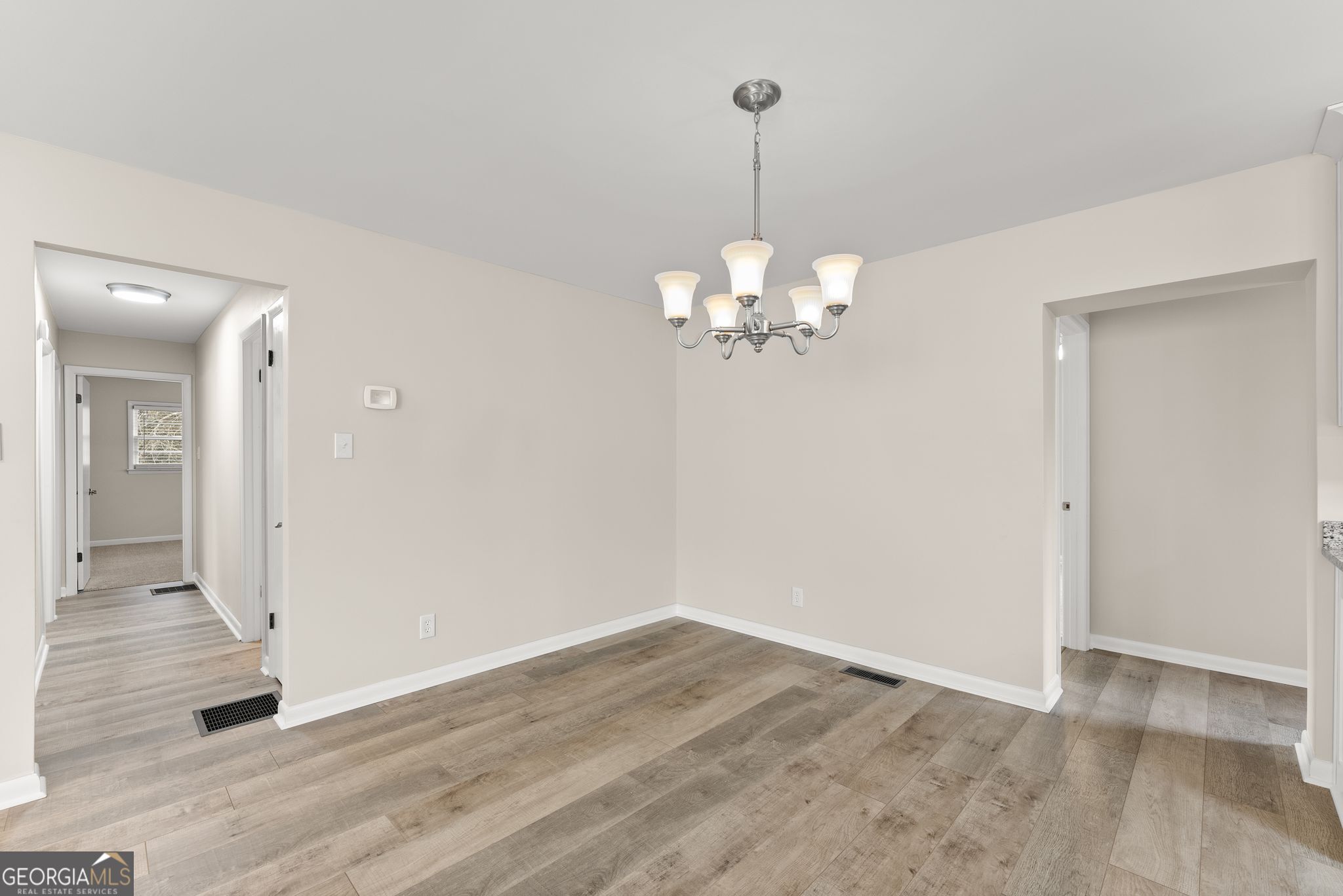 1292 Fernside Drive Toccoa, GA 30577 - Photo 11 of 42 a view of a chandelier in a room with wooden floor