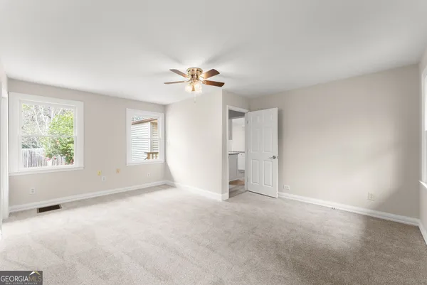 a view of an empty room with a window