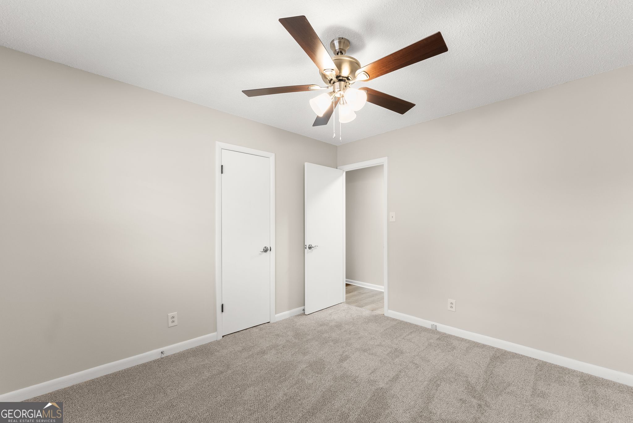 1292 Fernside Drive Toccoa, GA 30577 - Photo 20 of 42 an empty room with wooden floor and a ceiling fan