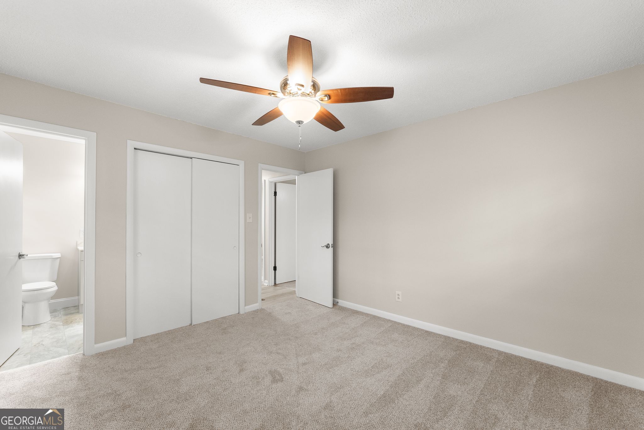 1292 Fernside Drive Toccoa, GA 30577 - Photo 25 of 42 a view of a room with a ceiling fan and a bathroom