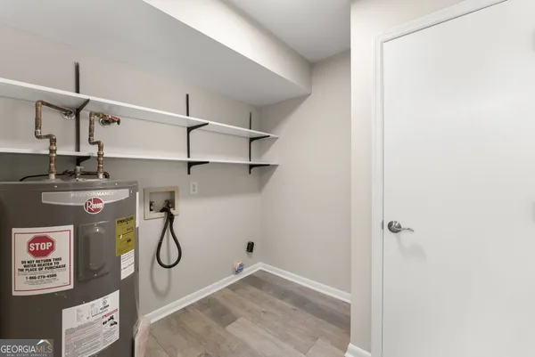 a view of a storage & utility room with utility room