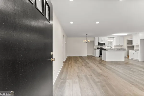 a view of kitchen with wooden floor