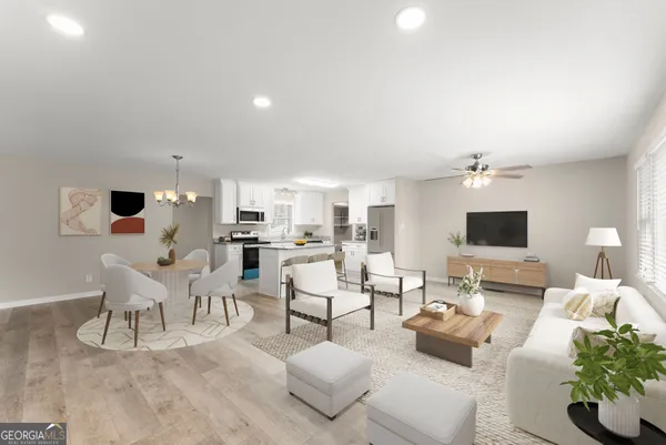 a living room with furniture and a flat screen tv