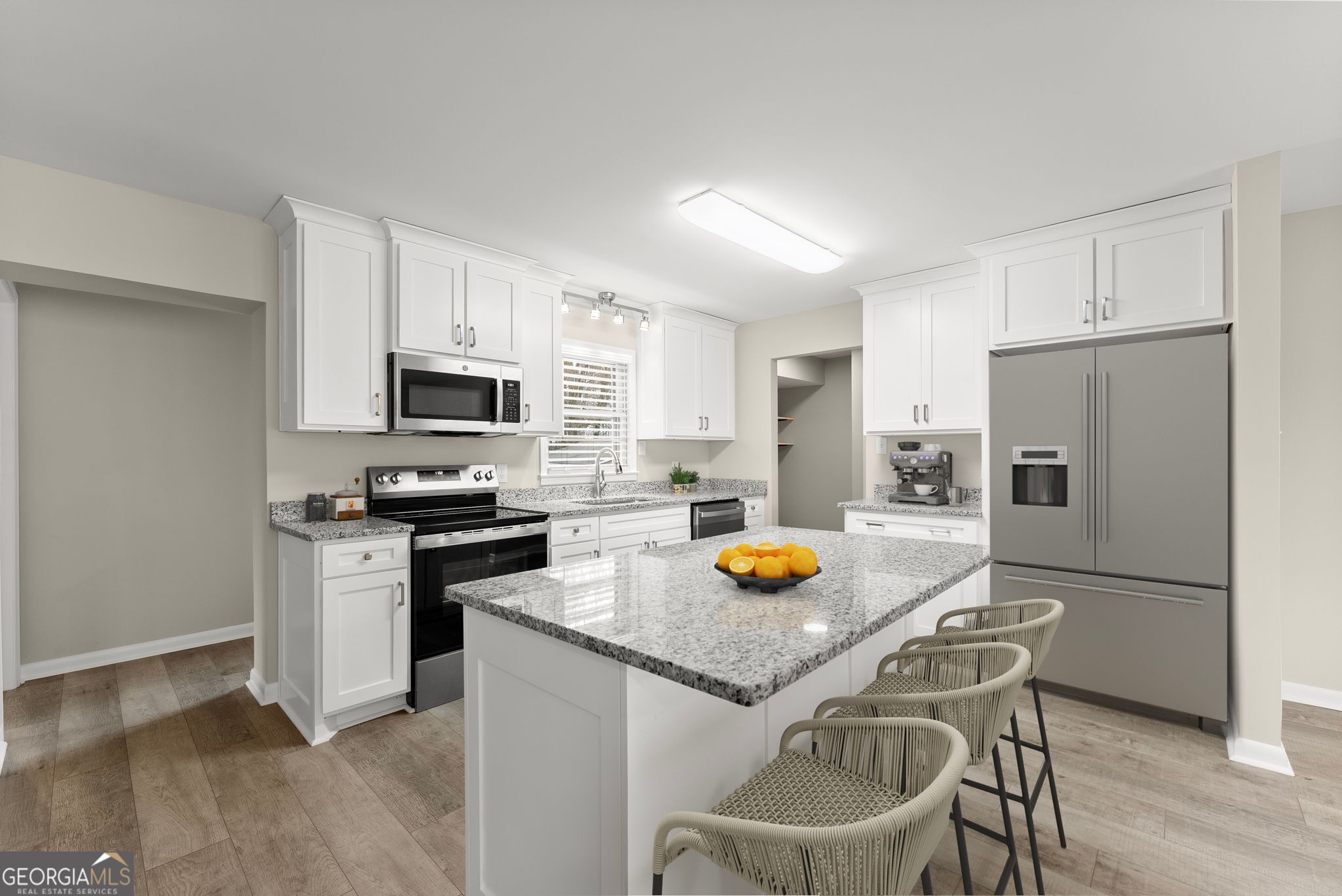 1292 Fernside Drive Toccoa, GA 30577 - Photo 7 of 42 a kitchen with stainless steel appliances a stove a sink a refrigerator a stove a dining table and chairs