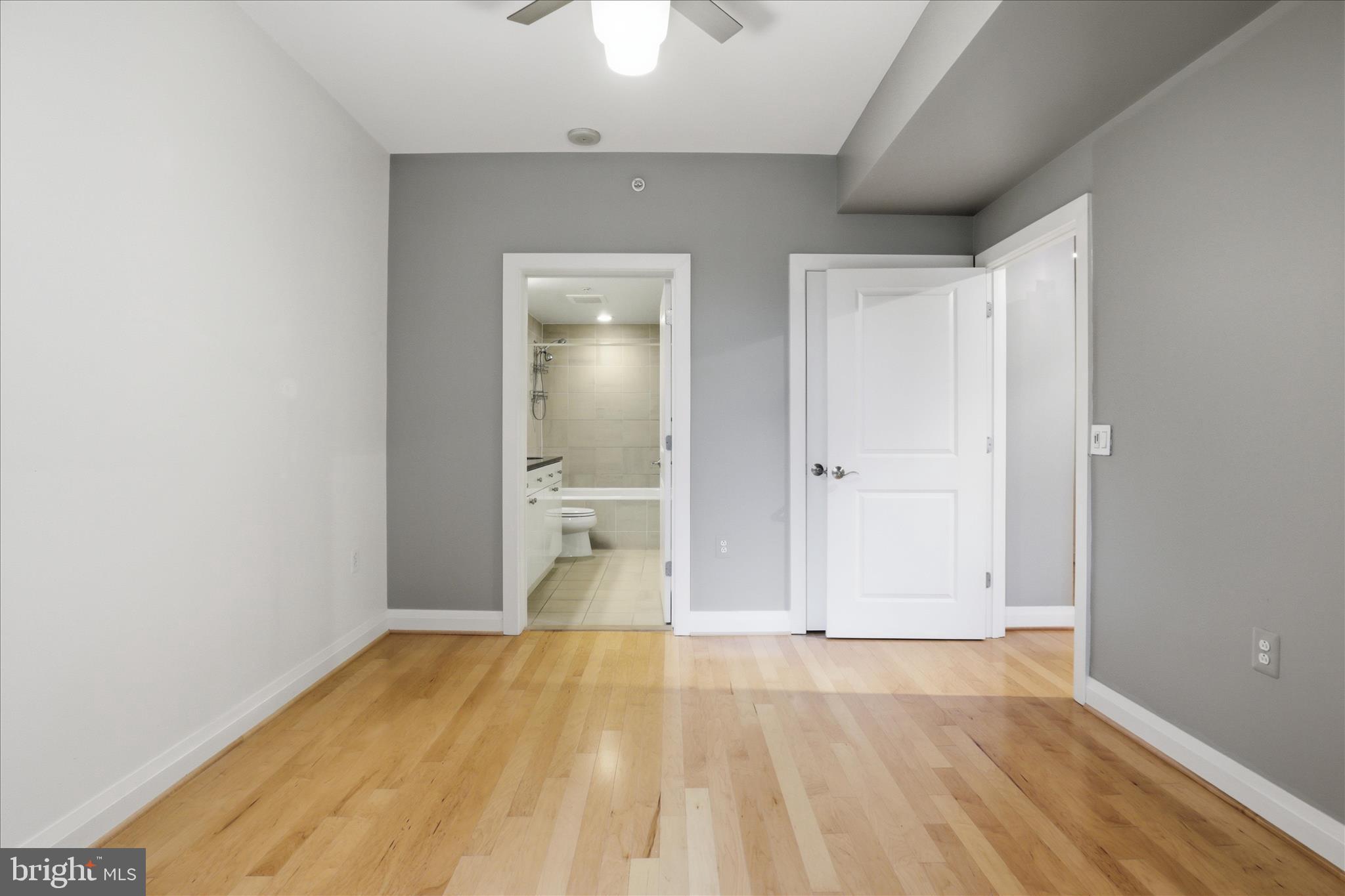 11990 Market Street, Unit 216 Reston, VA 20190 - Photo 29 of 41 wooden floor in an empty room